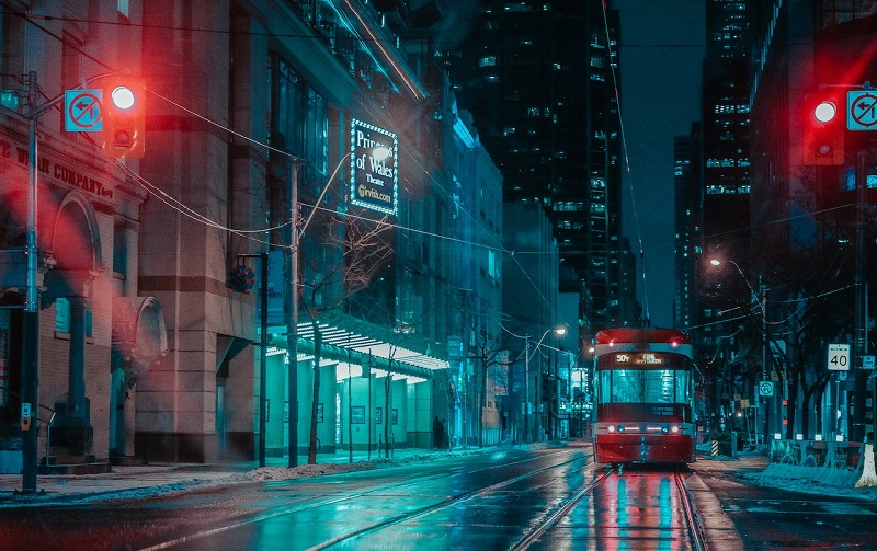 Toronto streetcar in the rain in front of the Mirvish Theatre